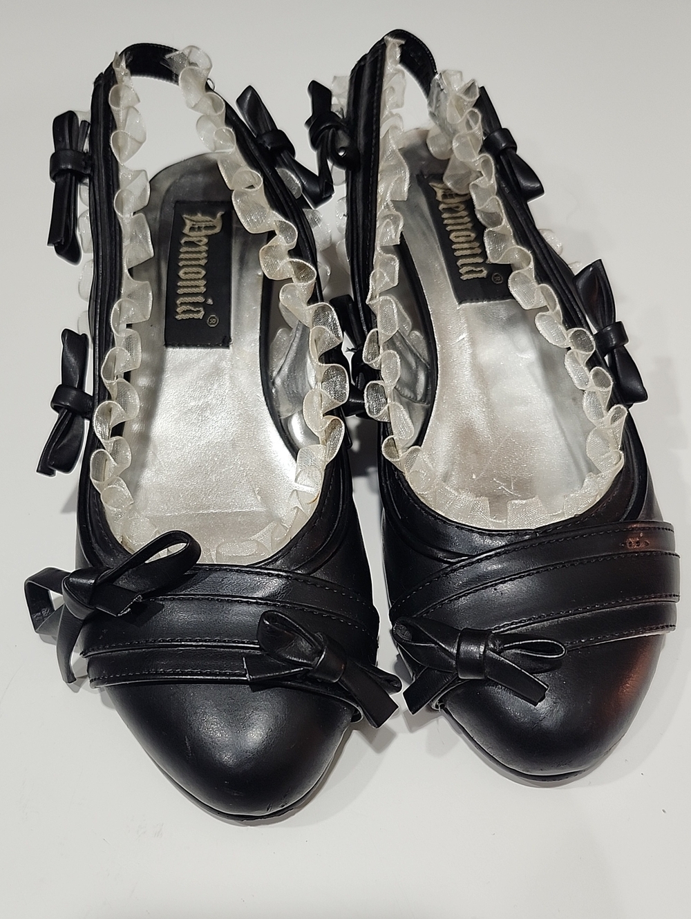 Demonia Black Ruffle-Trim Bow Slingback Pumps